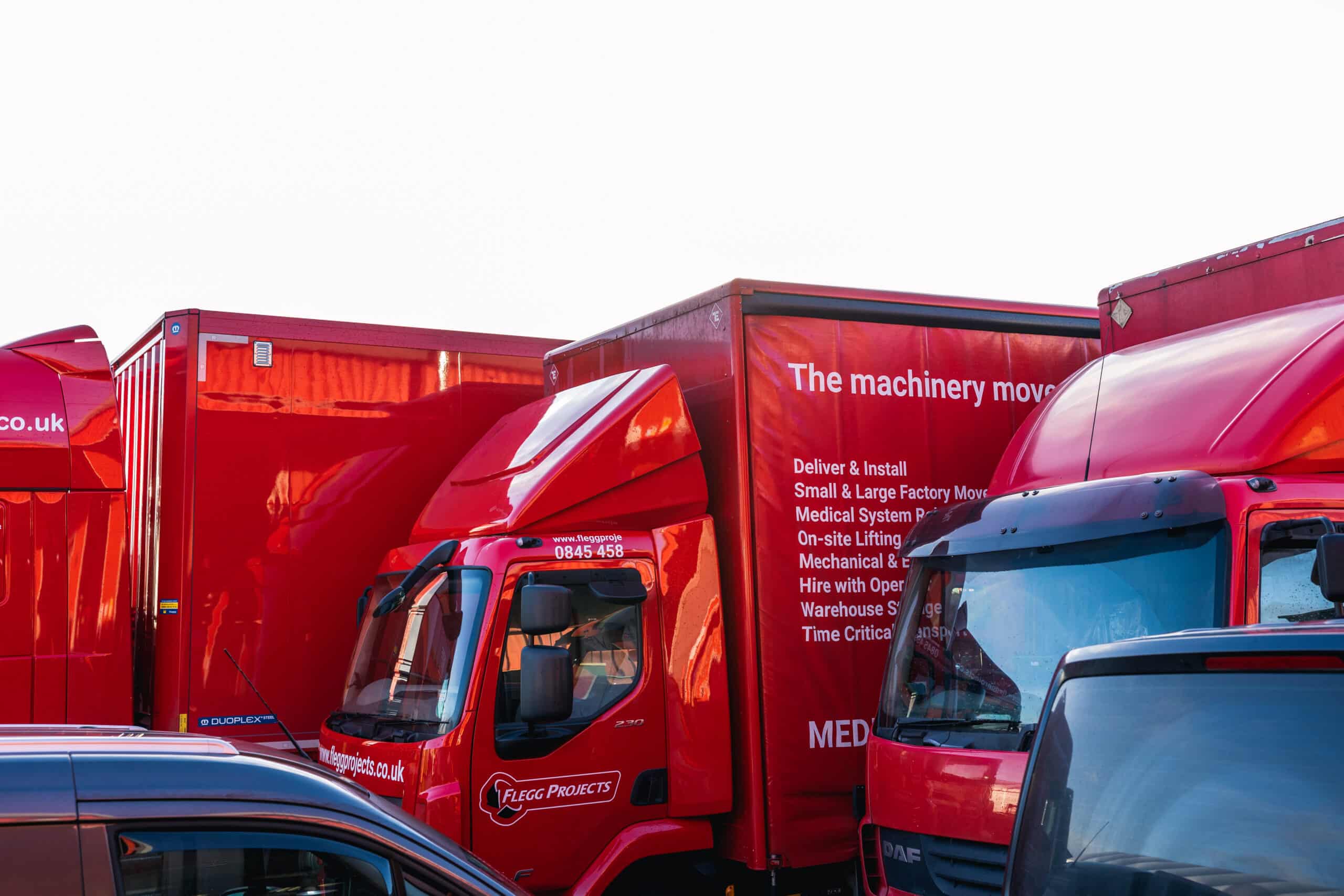 red trucks parked side by side