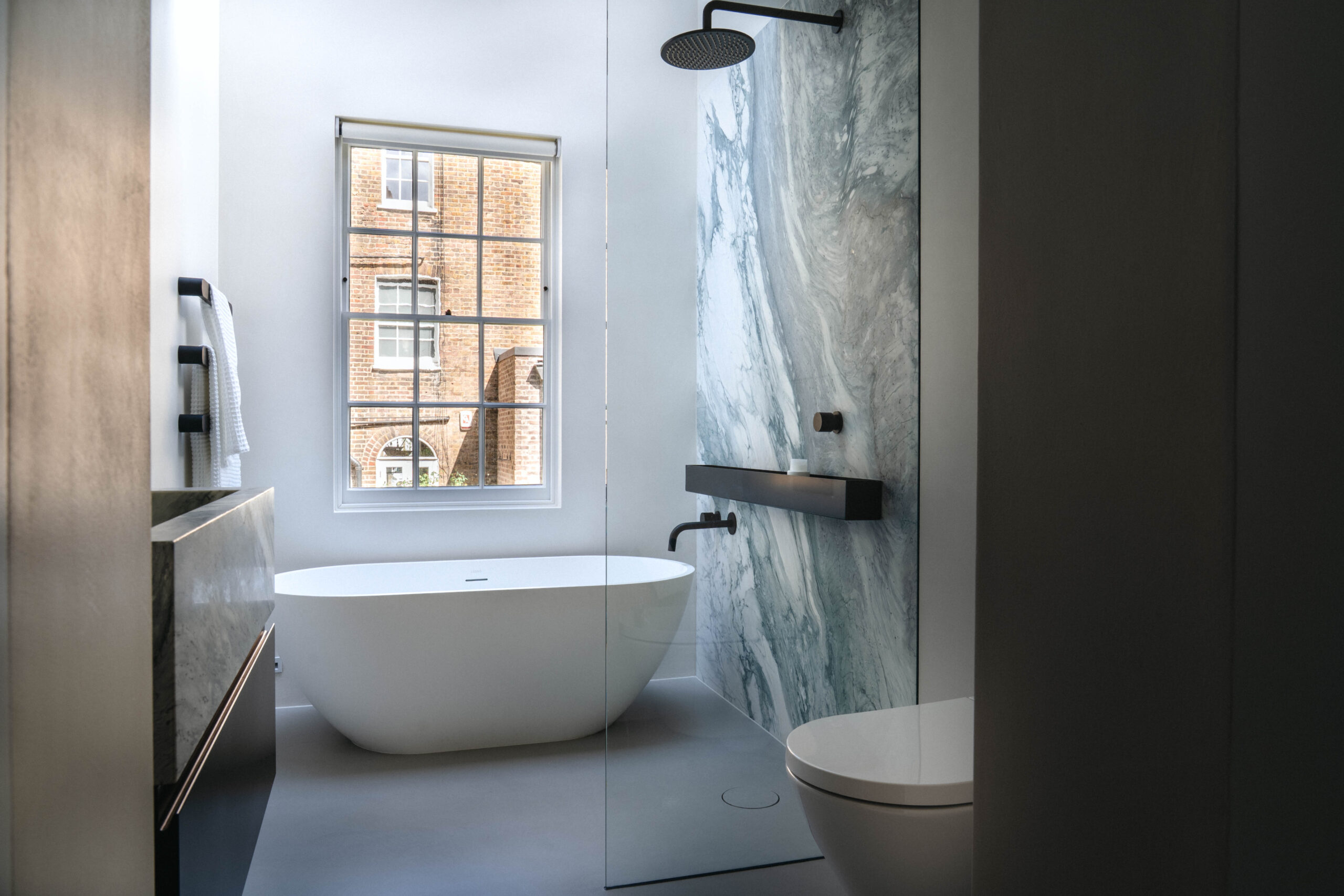 bathroom with marble shower
