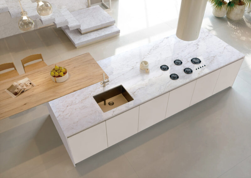     perla venata quartz surface in warm neutral kitchen design