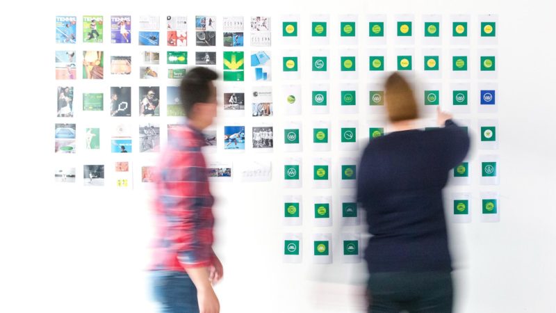 Discussing strategy on whiteboard