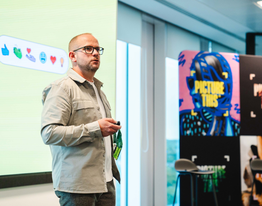 Martin giving a presentation on stage at a "Picture This" creative industry event.