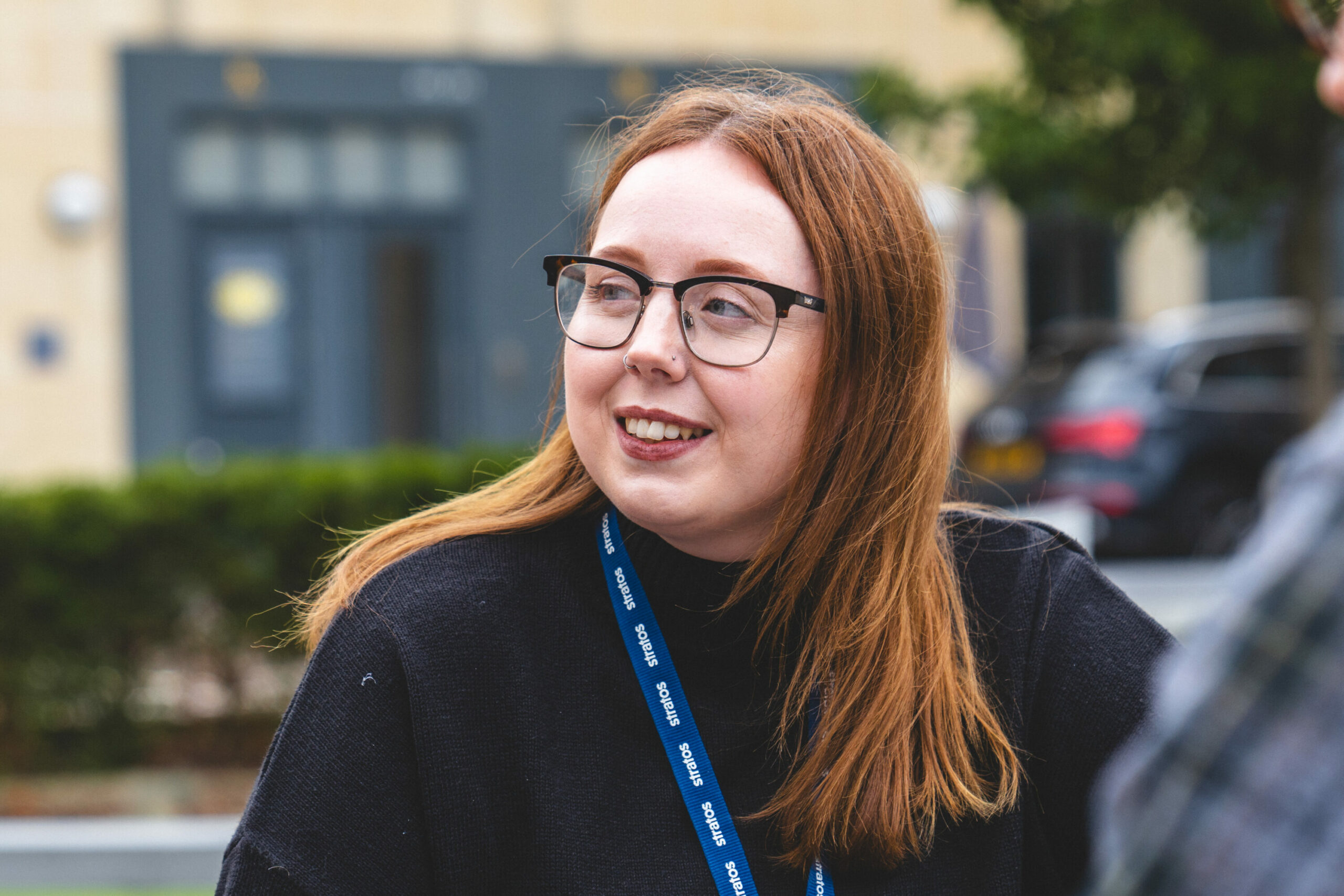 Amy wearing a company lanyard, representing our company culture.