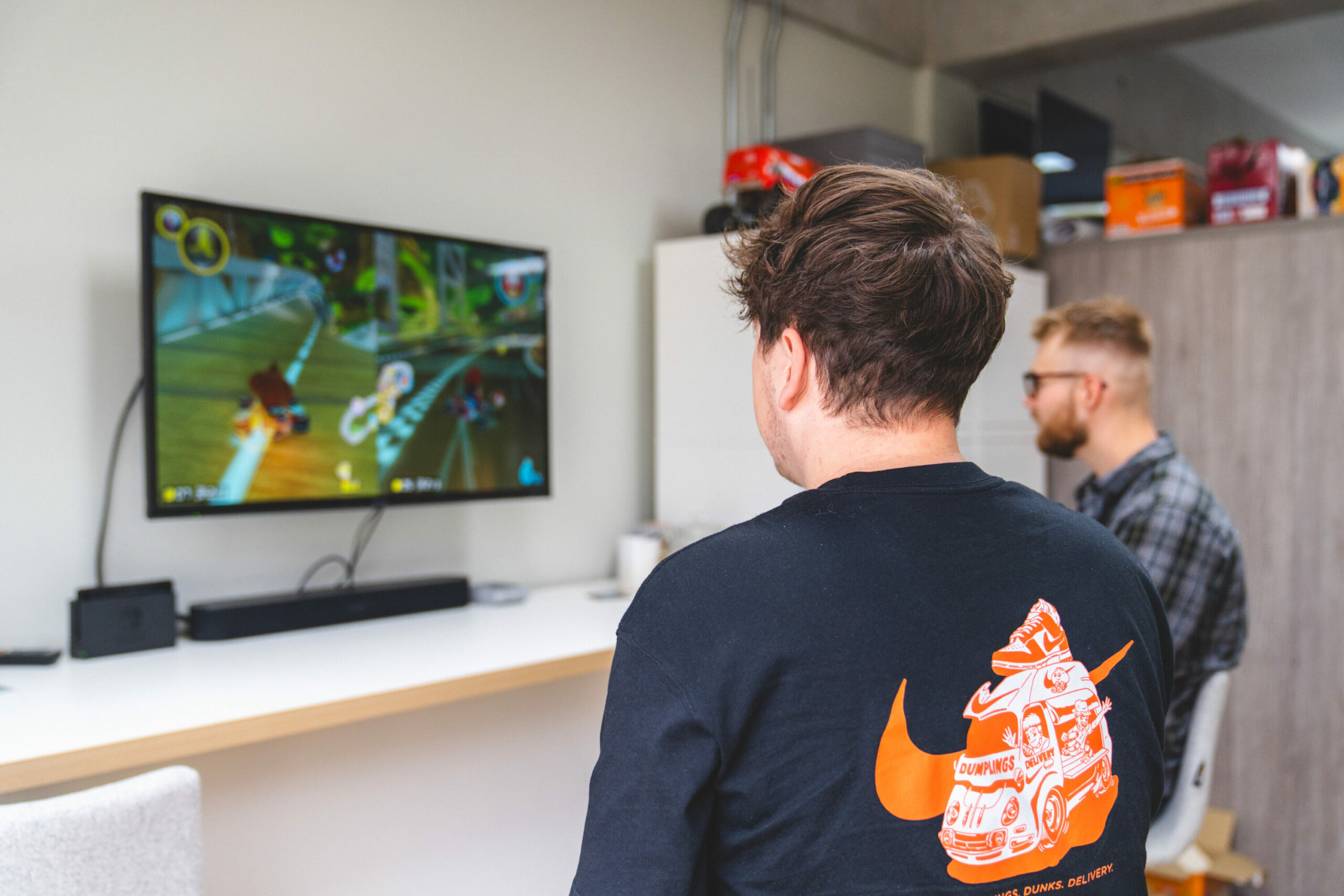 The Stratos team taking a well-deserved break and bonding over video games in the office.