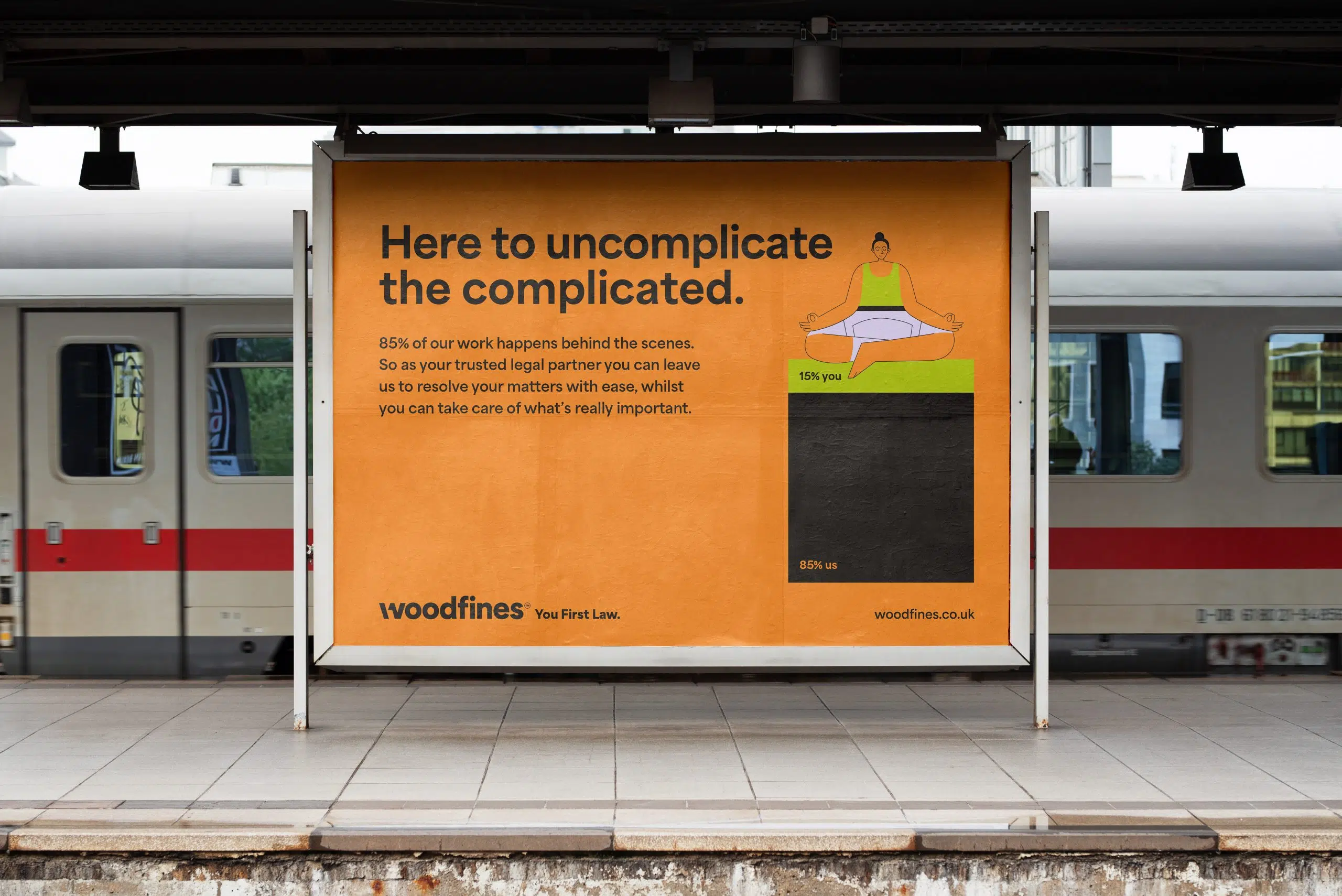 Woodfines billboard with yoga illustration and message about simplifying legal services