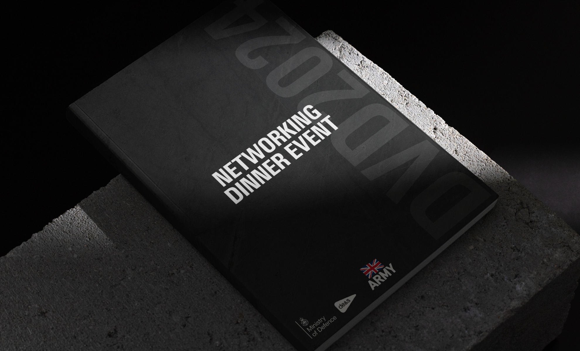 Black networking dinner event booklet with minimalist typography.