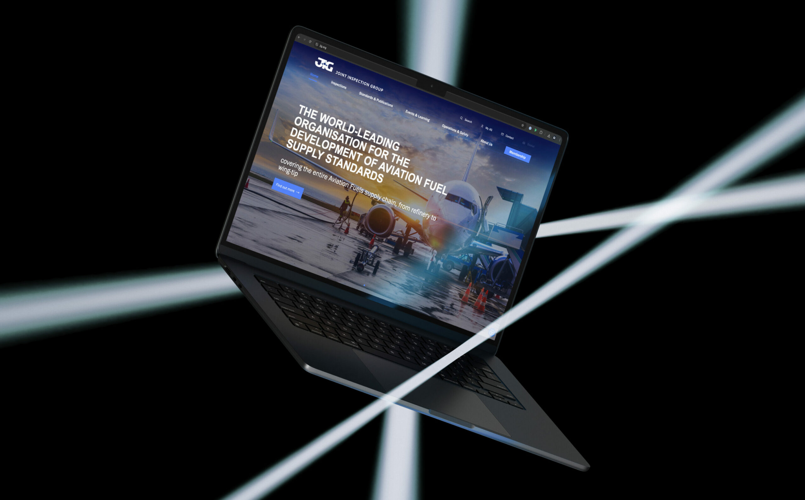 The new Joint Inspection Group (JIG) website for the aviation industry, displayed on a laptop to showcase the redesigned digital experience.
