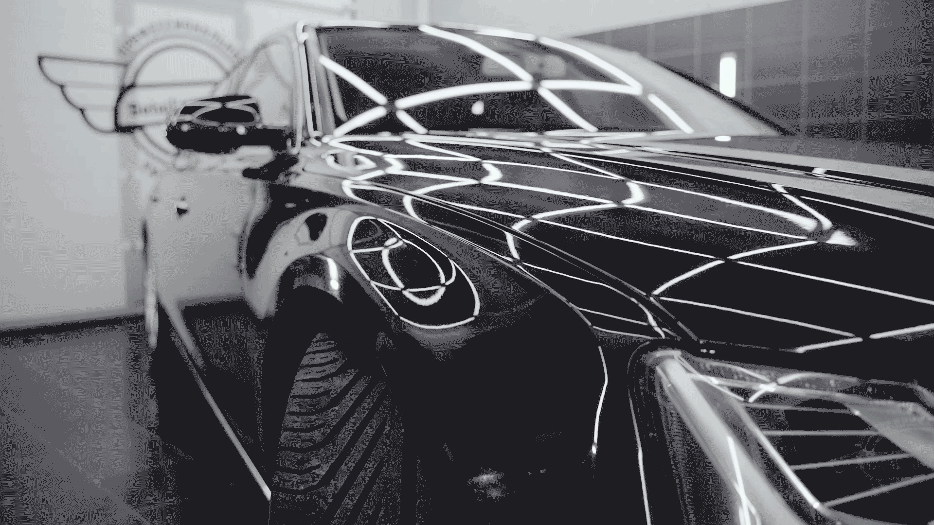 An animated GIF showcasing the flawless, mirror-like shine on a car after being treated with Dachs detailing products.