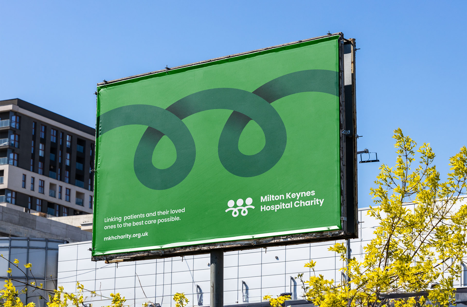 Milton Keynes Hospital Charity rebrand by Stratos Creative, green billboard with charity logo