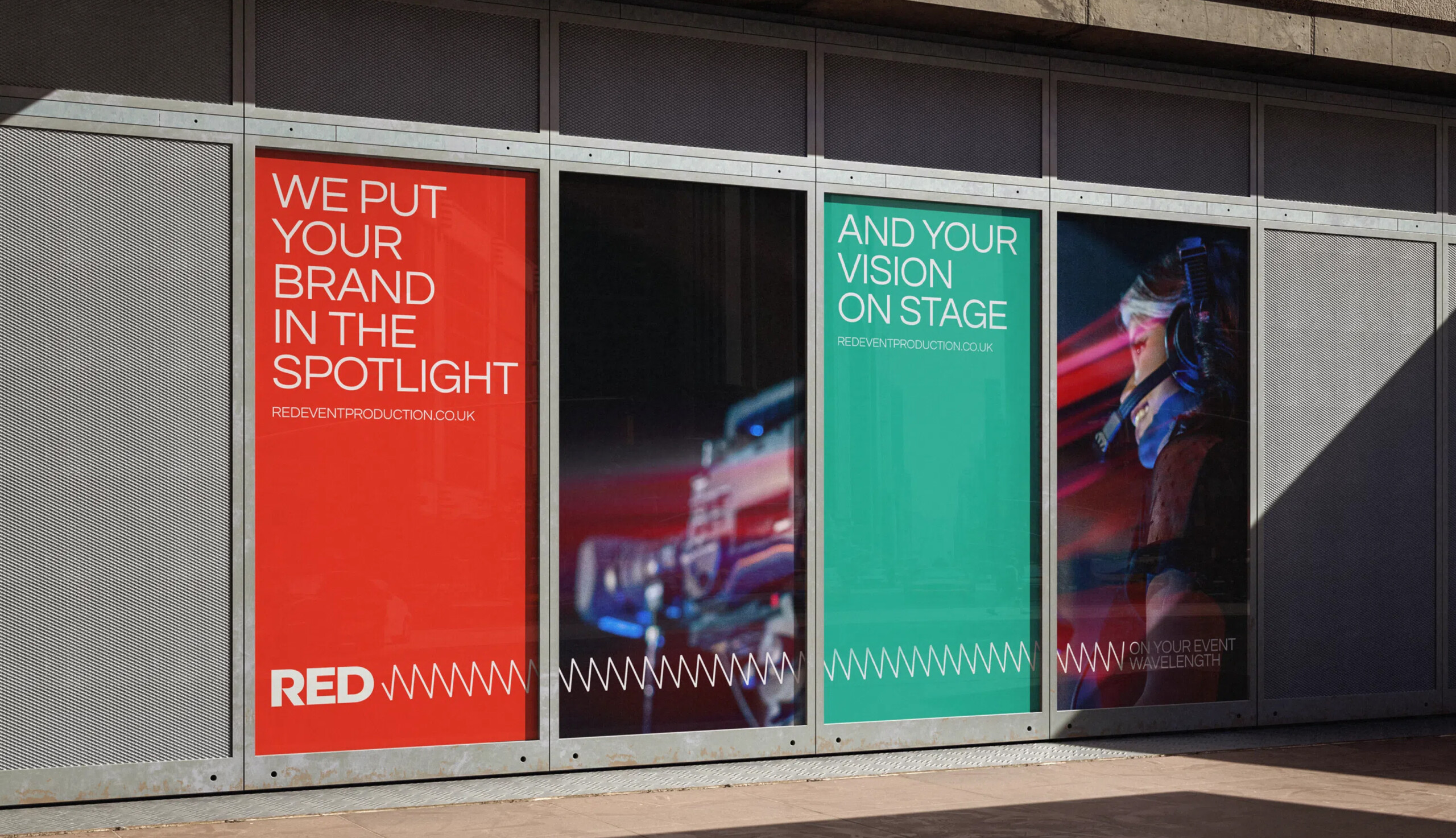 Branded window display showcasing RED’s event production messaging.