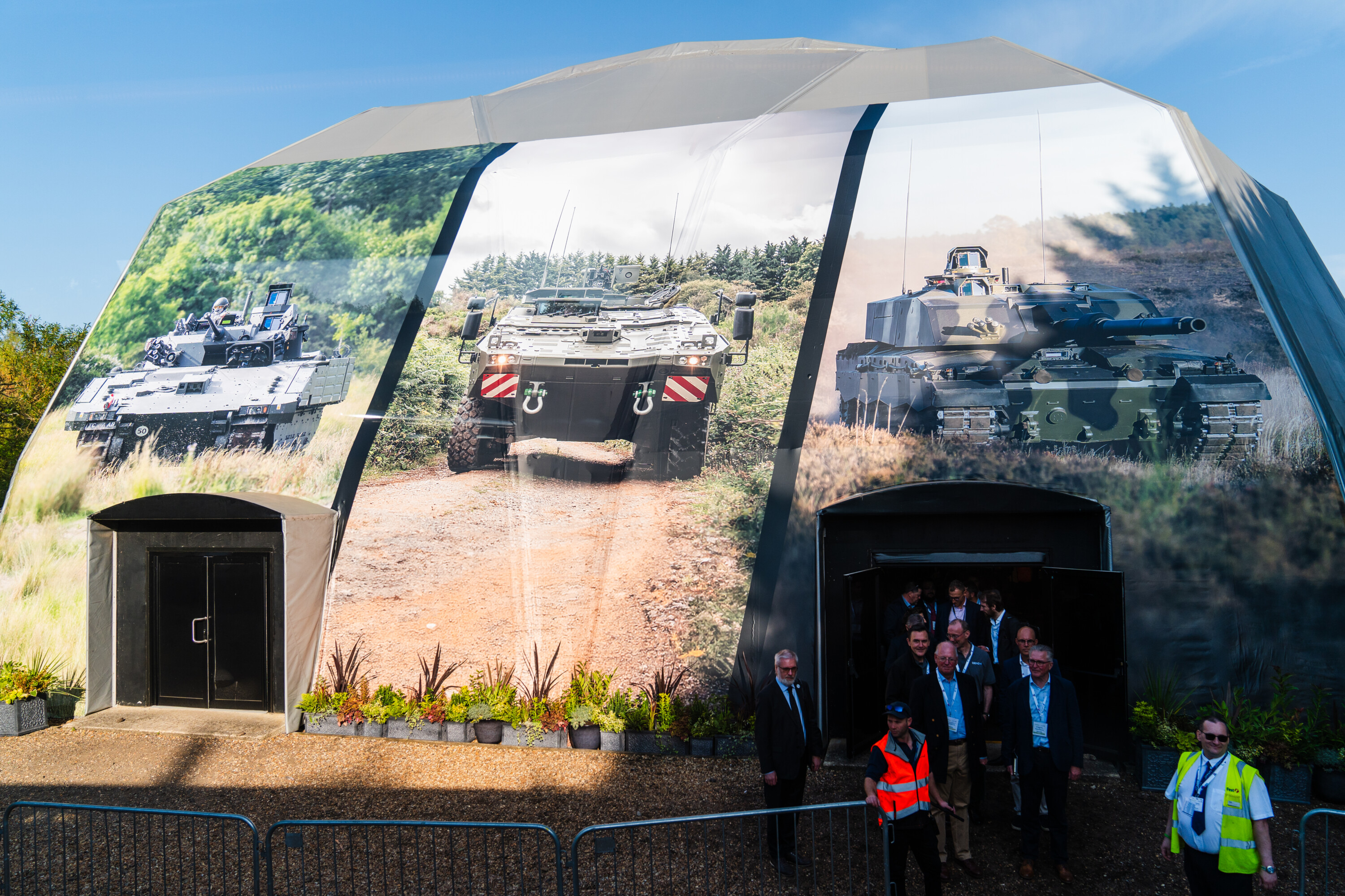 large tent with tank imagery over it