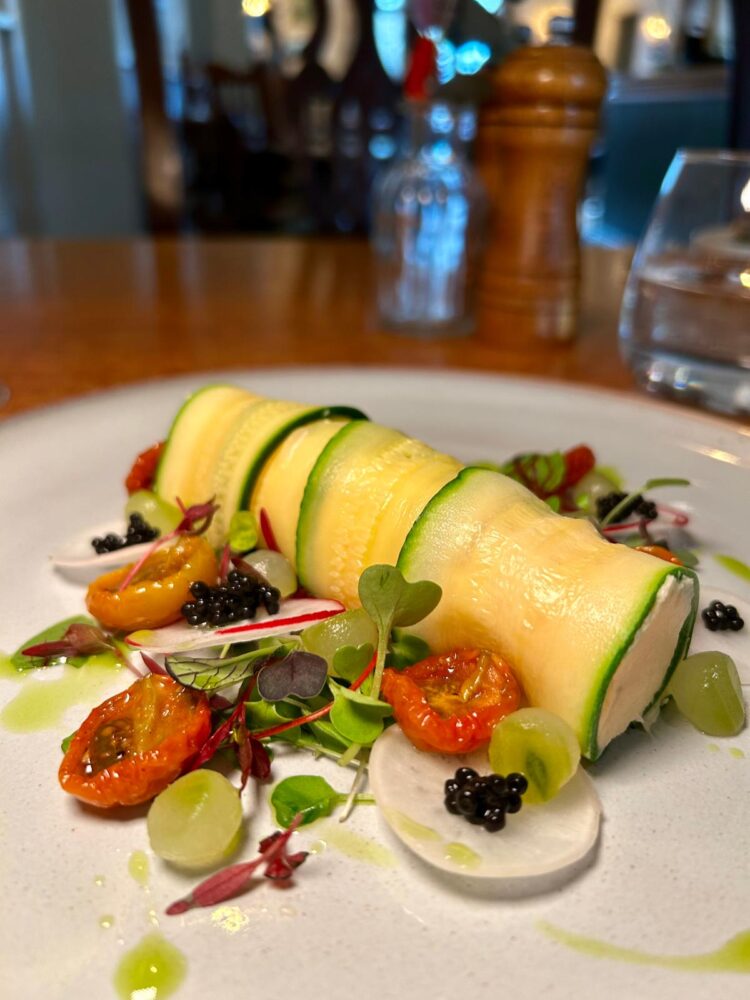Smoked salmon and courgette cannelloni, spring salad, caviar, edible flowers