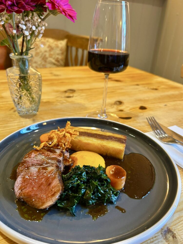 Roasted rump of lamb, carrot puree, lamb shoulder Anna potato, cavolo nero, rosemary braised carrots, carrot crisps, rosemary jus