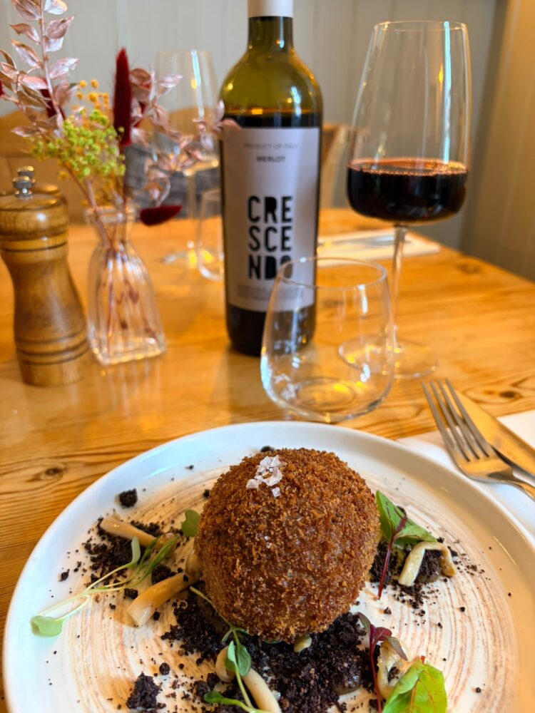 Venison Scotch egg, coffee and chocolate soil, mushroom puree, pickled shimeji mushroom