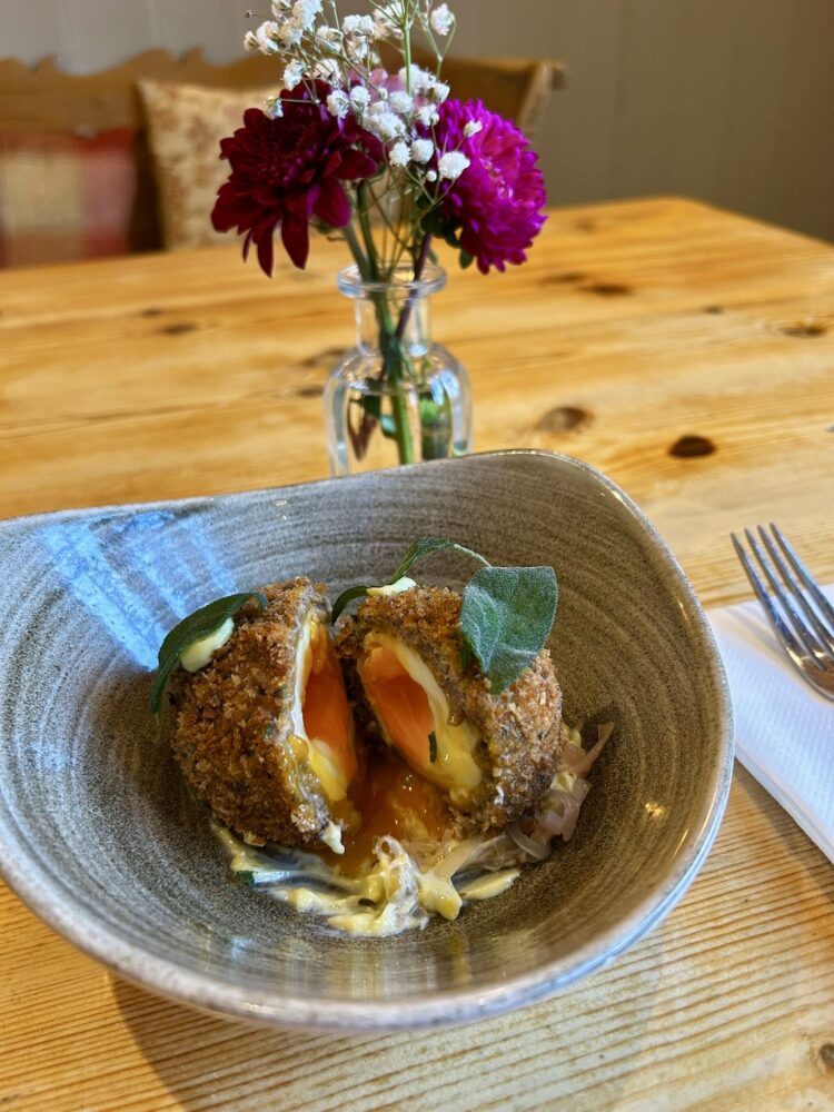 Venison and juniper scotch egg, sage emulsion, whiskey shallots