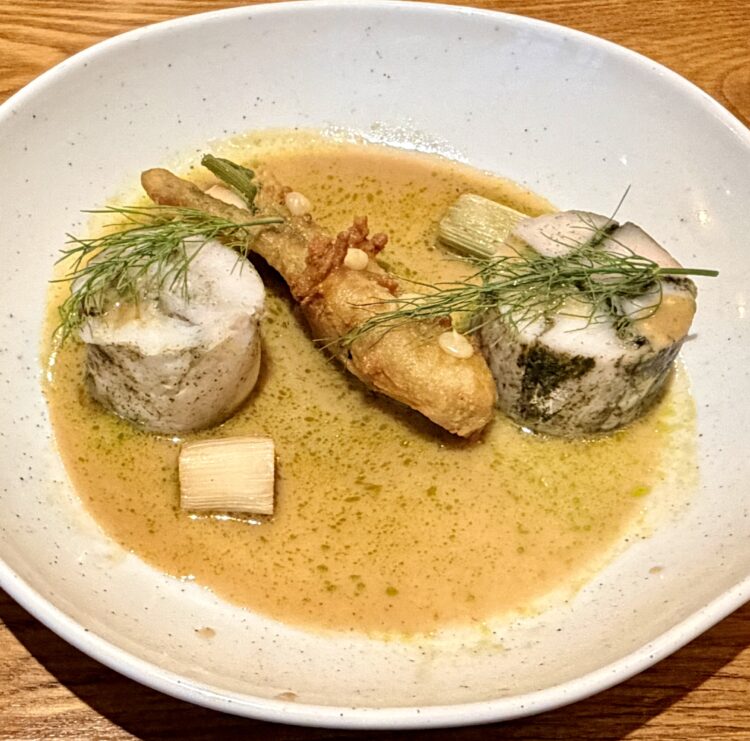 Poached hake and nori ballotine, tempura courgette flower, baked lemon puree, braised fennel, dill oil