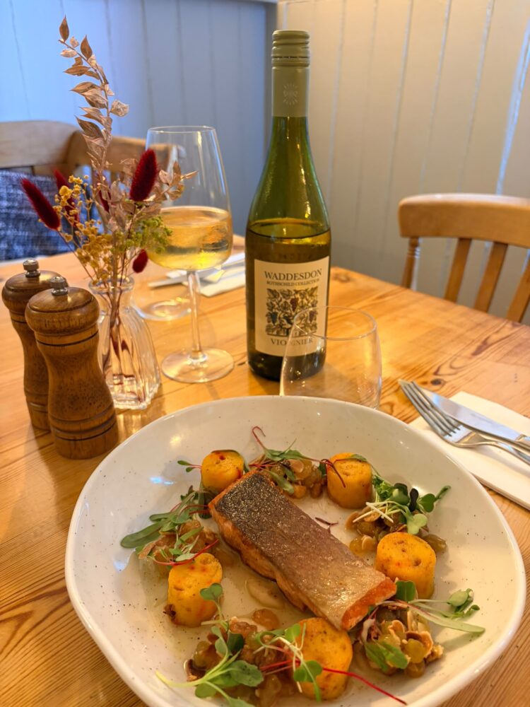 Pan seared Trout, saffron gnocchi, golden raisin and almond dressing, cauliflower puree