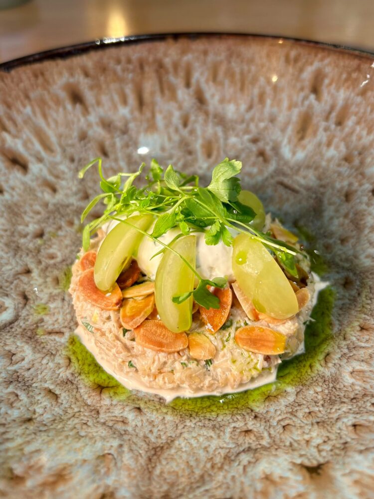 White crab salad, chive crème fraiche, pickled grapes, roasted almonds, ajo blanco, chive oil