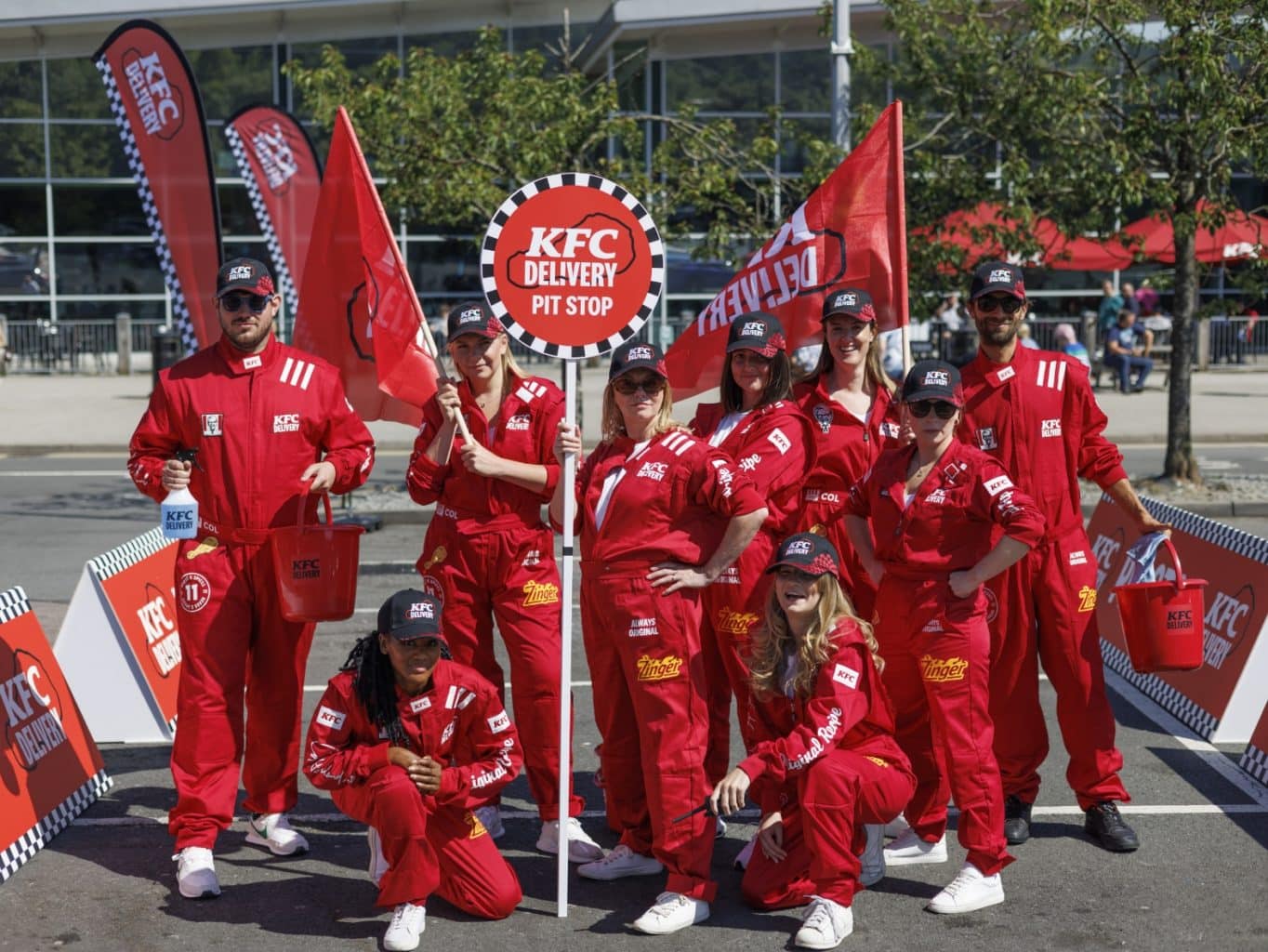 people dressed in red overalls