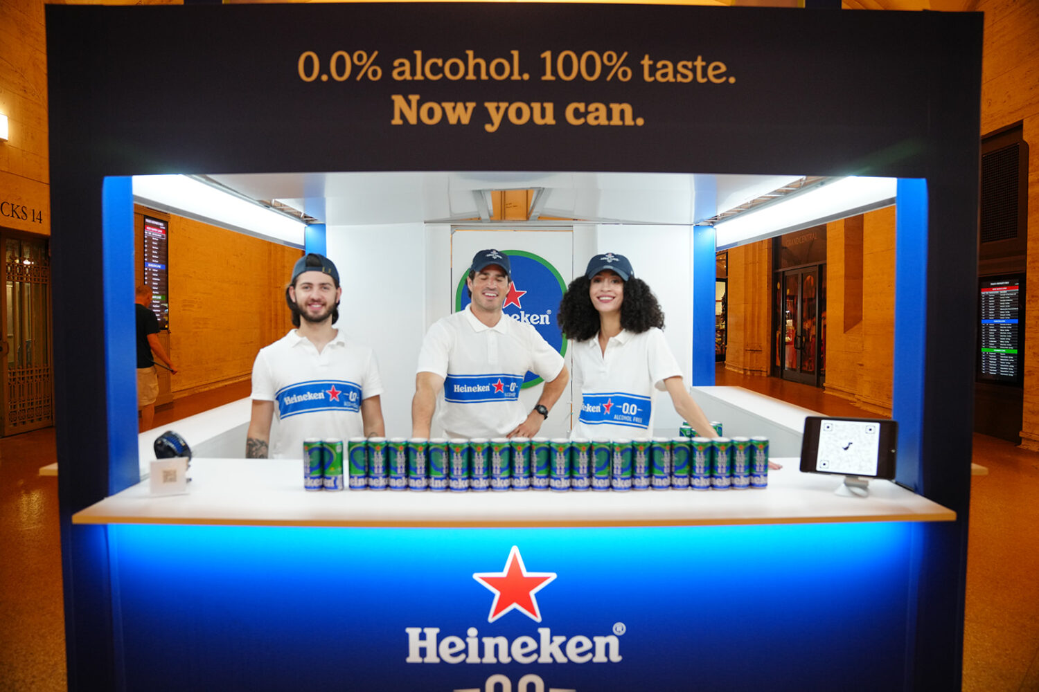 staff in blue branded promotional stand