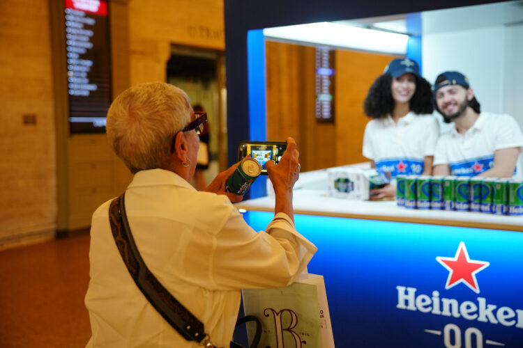 woman taking photo of staff