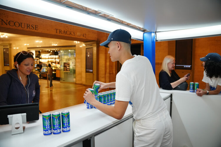 man pouring a beer from a can