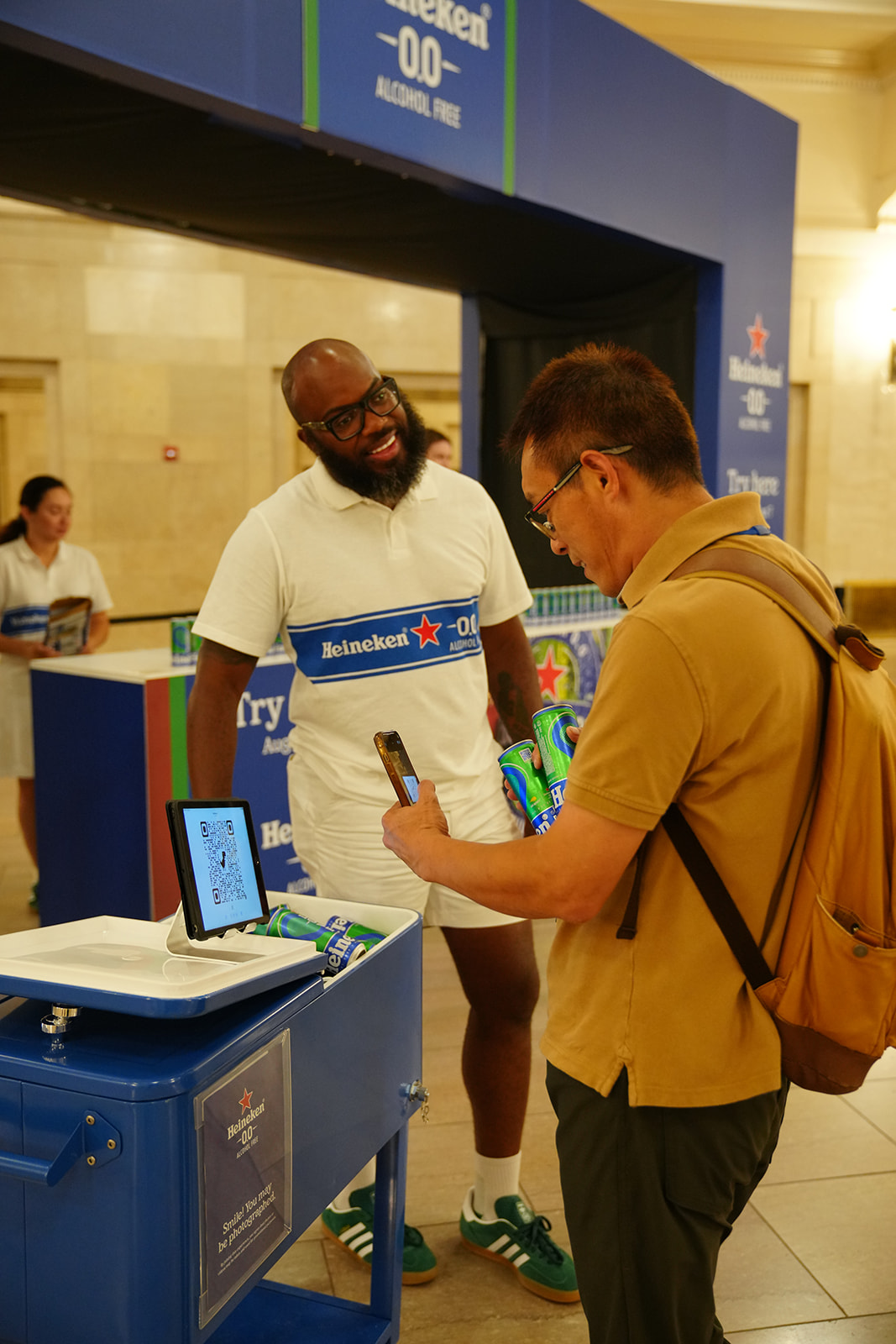 man smiling while talking to customer