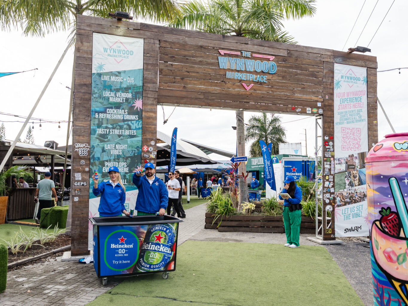 large heineken sign on a beachfront